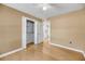 Cozy bedroom with a ceiling fan, closet, ensuite bathroom, and neutral walls at 1402 Camp Rd # 8B, Charleston, SC 29412