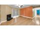 Bright living room featuring a cozy fireplace and sliding glass door at 1402 Camp Rd # 8B, Charleston, SC 29412