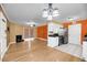 Inviting living room open to the kitchen with fireplace and sliding door at 1402 Camp Rd # 8B, Charleston, SC 29412
