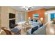 Stylized living room with a fireplace, ceiling fan, and sliding glass door at 1402 Camp Rd # 8B, Charleston, SC 29412