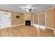 Open living room featuring a cozy fireplace and sliding glass door at 1402 Camp Rd # 8B, Charleston, SC 29412
