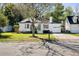 Charming single-story home featuring a well-maintained lawn, attached garage, and lovely curb appeal at 1589 Kentwood Cir, Charleston, SC 29412
