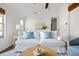 Bright living room featuring a vaulted ceiling, stylish decor, and comfortable seating at 1589 Kentwood Cir, Charleston, SC 29412