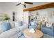 Bright and spacious living room area showcasing stylish decor, comfortable seating and a kitchen view at 1589 Kentwood Cir, Charleston, SC 29412