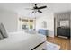 Serene main bedroom with a bay window, hardwood floors, and a view of the ensuite bathroom at 1589 Kentwood Cir, Charleston, SC 29412