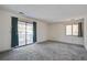 Bedroom featuring sliding door with view to the patio and windows allowing lots of natural light at 1714 Greystone Blvd # 47, Mount Pleasant, SC 29464