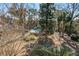 Relaxing community pool surrounded by lush landscaping and mature trees at 1714 Greystone Blvd # 47, Mount Pleasant, SC 29464