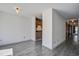 Hallway with view into kitchen and wood-style flooring at 1714 Greystone Blvd # 47, Mount Pleasant, SC 29464