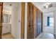 Hallway with a closet that leads to a bathroom with vanity at 1714 Greystone Blvd # 47, Mount Pleasant, SC 29464