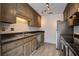Galley kitchen featuring stainless steel appliances, cabinets and a double sink at 1714 Greystone Blvd # 47, Mount Pleasant, SC 29464