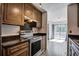Kitchen featuring stainless steel appliances with open view to the balcony at 1714 Greystone Blvd # 47, Mount Pleasant, SC 29464