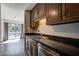 Kitchen showcasing stainless sink, and view of the sliding balcony door at 1714 Greystone Blvd # 47, Mount Pleasant, SC 29464