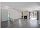Bright living room boasts fireplace, balcony access, and stylish gray flooring at 1714 Greystone Blvd # 47, Mount Pleasant, SC 29464