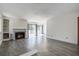 Open living room featuring a fireplace, balcony access, and modern flooring at 1714 Greystone Blvd # 47, Mount Pleasant, SC 29464