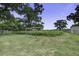 Large backyard with a wooden pergola, offering potential for a garden or relaxation area at 1758 Mendel Rivers Rd, Saint Stephen, SC 29479