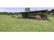 Spacious barn with ample storage for equipment and supplies, set on a large grassy lot at 1758 Mendel Rivers Rd, Saint Stephen, SC 29479