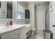 Bright bathroom with white vanity, neutral walls, and plenty of natural light from the window at 1758 Mendel Rivers Rd, Saint Stephen, SC 29479