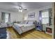 Cozy bedroom with hardwood floors, a ceiling fan, and neutral decor at 1758 Mendel Rivers Rd, Saint Stephen, SC 29479