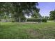 Outdoor area featuring a chicken coop and fenced space, ideal for raising poultry in the backyard at 1758 Mendel Rivers Rd, Saint Stephen, SC 29479