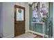 Inviting foyer featuring hardwood floors, a decorative front door, and a charming accent table at 1758 Mendel Rivers Rd, Saint Stephen, SC 29479