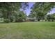 Beautiful brick home with a well-maintained lawn and mature trees in the front yard at 1758 Mendel Rivers Rd, Saint Stephen, SC 29479