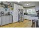 Well-lit kitchen with white cabinetry, stainless steel appliances, and hardwood flooring at 1758 Mendel Rivers Rd, Saint Stephen, SC 29479