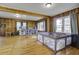Spacious living room featuring wood paneling, hardwood floors and plenty of natural light at 1758 Mendel Rivers Rd, Saint Stephen, SC 29479