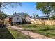 Spacious backyard with a brick pathway, lawn, and multiple houses at 18 Sothel Ave, Charleston, SC 29407