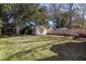Backyard featuring a guest house, lush lawn, and wood fence at 18 Sothel Ave, Charleston, SC 29407