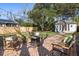 Backyard with a brick patio and a guest house in the background at 18 Sothel Ave, Charleston, SC 29407