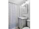 Bathroom with shower featuring patterned curtain, vanity, and updated lighting at 18 Sothel Ave, Charleston, SC 29407