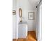 Bright bathroom with white walls and a brass faucet, featuring a unique mirror at 18 Sothel Ave, Charleston, SC 29407