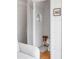 Bright bathroom with white walls and a round portal window at 18 Sothel Ave, Charleston, SC 29407
