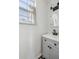 Bright bathroom featuring gray vanity, black hardware, and a window allowing ample natural light at 18 Sothel Ave, Charleston, SC 29407