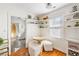 Cozy dining area with a round table, built-in shelving, and natural light at 18 Sothel Ave, Charleston, SC 29407
