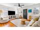 Comfortable living room with a TV, neutral seating, and bright natural light at 18 Sothel Ave, Charleston, SC 29407