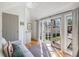 Bright living room with a white sofa and doors leading to the outside at 18 Sothel Ave, Charleston, SC 29407