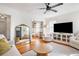 Inviting living room with hardwood floors, a large mirror, and open shelving at 18 Sothel Ave, Charleston, SC 29407