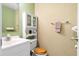Neat bathroom featuring a white vanity, decorative mirror, and neutral walls at 1860 Mepkin Rd # H1, Charleston, SC 29407