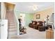 Inviting living room featuring a staircase, comfortable seating, and neutral color palette at 1860 Mepkin Rd # H1, Charleston, SC 29407