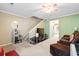 Cozy living room featuring a TV, sofa, stairs and an open space at 1860 Mepkin Rd # H1, Charleston, SC 29407