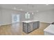 Modern kitchen with gray island, stainless steel appliances, and an open layout for casual living at 2021 Quiet Ibis Rd, Hanahan, SC 29410