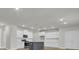 Spacious kitchen featuring white cabinets, stainless steel appliances, and a gray island at 2021 Quiet Ibis Rd, Hanahan, SC 29410