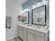 Bright bathroom features a dual vanity with modern lighting and mirrors, with a tiled walk-in shower at 2322 Watchtower Ln, Charleston, SC 29414