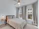 Inviting bedroom with large windows, a comfortable bed, and neutral decor creating a serene and restful space at 2322 Watchtower Ln, Charleston, SC 29414
