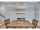 Elegant dining room with a wooden table and a contemporary chandelier at 2322 Watchtower Ln, Charleston, SC 29414
