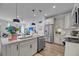Bright, open kitchen featuring a large island with sink and stainless steel appliances at 2322 Watchtower Ln, Charleston, SC 29414