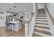Beautiful kitchen with island seating and a staircase leading to the upper level at 2322 Watchtower Ln, Charleston, SC 29414