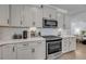 Modern kitchen with stainless steel appliances, white cabinets, and subway tile backsplash at 2322 Watchtower Ln, Charleston, SC 29414