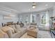 Bright and airy living area with a large sectional and a view to the outdoors at 2322 Watchtower Ln, Charleston, SC 29414